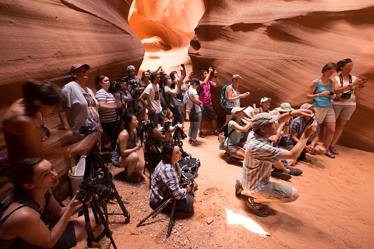 Photographers lined up, ready to photograph the light beams